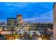 Balcony view overlooking the city skyline with distant mountains and bright city lights at dusk at 16 W Encanto Blvd # 616, Phoenix, AZ 85003