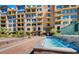Exterior shot of a multi-story apartment building with a water feature at 16 W Encanto Blvd # 616, Phoenix, AZ 85003