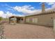 Neutral colored house with large gravel backyard and covered patio, perfect for low-maintenance living at 16028 N Nyack Dr, Fountain Hills, AZ 85268