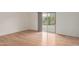 Minimalist bedroom featuring hardwood floors and sliding door access to a patio at 16028 N Nyack Dr, Fountain Hills, AZ 85268