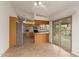 An open concept kitchen and dining area with tile floors and outdoor access at 16028 N Nyack Dr, Fountain Hills, AZ 85268