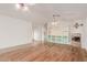 Spacious living room featuring beautiful hardwood floors and a fireplace at 16028 N Nyack Dr, Fountain Hills, AZ 85268