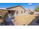 Home's backyard featuring a covered patio and space for outdoor activities at 16167 W Cottonwood St, Surprise, AZ 85374