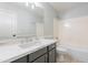 A clean bathroom featuring a vanity with chrome fixtures, and a tub and shower combo at 16167 W Cottonwood St, Surprise, AZ 85374