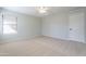 Large bedroom features a ceiling fan and neutral carpet, with a closet door and ample space at 16167 W Cottonwood St, Surprise, AZ 85374