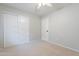 Neutral bedroom featuring a ceiling fan, and closet for storage at 16167 W Cottonwood St, Surprise, AZ 85374