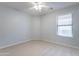 Well-lit bedroom features a window and a ceiling fan for added comfort at 16167 W Cottonwood St, Surprise, AZ 85374
