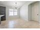 Bright dining area features an archway to another room and tile flooring with natural light from a window at 16167 W Cottonwood St, Surprise, AZ 85374