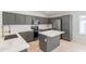 Beautiful kitchen with white quartz countertops, stainless steel appliances, and dark cabinetry at 16167 W Cottonwood St, Surprise, AZ 85374