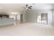 Bright open-concept living space featuring neutral walls, ample natural light, and a seamless kitchen view at 16167 W Cottonwood St, Surprise, AZ 85374