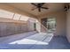 Covered patio featuring a ceiling fan and sliding glass door at 16167 W Cottonwood St, Surprise, AZ 85374