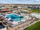 Relax by the community pool with shaded seating, loungers, and nearby playground at 17624 W Adams St, Goodyear, AZ 85338