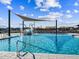 Inviting community swimming pool with a splash pad and shaded lounge area, perfect for Gathering fun at 17624 W Adams St, Goodyear, AZ 85338