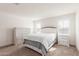 A bright bedroom showcasing neutral décor, a bed and decorative dressers at 18449 E Eloisa Dr, Gold Canyon, AZ 85118