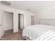 A bedroom featuring neutral décor, bed, and closets with open doorways at 18449 E Eloisa Dr, Gold Canyon, AZ 85118