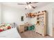 Bright and inviting bedroom featuring playful decor, natural wood furniture, and ample natural light at 18449 E Eloisa Dr, Gold Canyon, AZ 85118