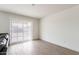 Bright bonus room with modern flooring and a sliding glass door at 18449 E Eloisa Dr, Gold Canyon, AZ 85118