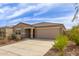 Attractive single-story home with a low-maintenance landscape and a welcoming entrance at 18449 E Eloisa Dr, Gold Canyon, AZ 85118