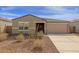 Charming single-story home with a neutral color scheme and a well-maintained front yard at 18449 E Eloisa Dr, Gold Canyon, AZ 85118