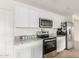Beautiful kitchen featuring modern appliances, white cabinets, and granite countertops at 18449 E Eloisa Dr, Gold Canyon, AZ 85118