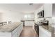 Well-lit kitchen with stainless steel appliances, granite countertops, and a large central island at 18449 E Eloisa Dr, Gold Canyon, AZ 85118