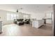 Spacious living room with a large sectional sofa, island seating, and a ceiling fan at 18449 E Eloisa Dr, Gold Canyon, AZ 85118
