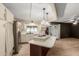Bright kitchen featuring an island with a built-in cooktop and modern stainless steel appliances at 201 S Greenfield Rd # 152, Mesa, AZ 85206
