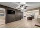 Open floor plan featuring updated floors, closet, and seamless transitions to the kitchen area at 201 S Greenfield Rd # 152, Mesa, AZ 85206