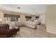 Open-concept living room features light flooring, a neutral palette, and ample seating at 201 S Greenfield Rd # 152, Mesa, AZ 85206