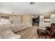 Open living space boasts new floors, a comfortable sofa, and seamless flow to other areas at 201 S Greenfield Rd # 152, Mesa, AZ 85206