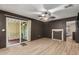 Cozy living area with modern flooring, opening to an outdoor patio and adjacent room at 201 S Greenfield Rd # 152, Mesa, AZ 85206