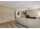 Spacious living area with updated floors, built-in shelving, and ample natural light at 201 S Greenfield Rd # 152, Mesa, AZ 85206