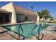 Community pool with a lounge area and well-maintained grounds at 201 S Greenfield Rd # 152, Mesa, AZ 85206