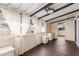 Relaxing sunroom with beamed ceilings, wicker furniture, and sheer curtains for privacy at 201 S Greenfield Rd # 152, Mesa, AZ 85206