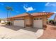 Spacious three-car garage with white doors and a concrete driveway at 21417 N 142Nd Dr, Sun City West, AZ 85375