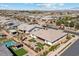 An aerial view of a home with artificial turf, pool and covered patio at 23145 E Stonecrest Dr, Queen Creek, AZ 85142