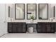 Lavish Primary bathroom with dual vanities, framed mirrors, and makeup station at 23145 E Stonecrest Dr, Queen Creek, AZ 85142
