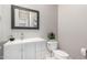 Charming powder room features a white vanity, stylish mirror, and sleek fixtures at 23145 E Stonecrest Dr, Queen Creek, AZ 85142