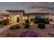 Inviting single-story home featuring a landscaped front yard with a decorative stone pathway, enhancing curb appeal at 23145 E Stonecrest Dr, Queen Creek, AZ 85142