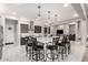 Open-concept kitchen featuring a large island with seating and pendant lighting, perfect for entertaining at 23145 E Stonecrest Dr, Queen Creek, AZ 85142