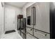 Bright laundry room with stainless steel appliances and tiled floors at 23145 E Stonecrest Dr, Queen Creek, AZ 85142