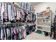 Spacious walk-in closet with built-in shelving and ample storage space for clothes and personal items at 23145 E Stonecrest Dr, Queen Creek, AZ 85142
