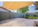 Backyard features a covered patio, plants, and privacy wall at 2317 E Concorda Dr, Tempe, AZ 85282