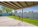 Inviting backyard featuring a covered patio and well-maintained lawn, perfect for outdoor relaxation and entertainment at 2317 E Concorda Dr, Tempe, AZ 85282