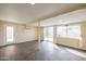 Open basement area with tile flooring, bright lighting, and access to the backyard at 2317 E Concorda Dr, Tempe, AZ 85282