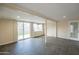 Spacious basement area with neutral walls, sliding glass doors, and tile flooring at 2317 E Concorda Dr, Tempe, AZ 85282