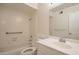 All-white bathroom with tub, shower, vanity, and mirror at 2317 E Concorda Dr, Tempe, AZ 85282