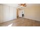 Bedroom with new wood floors, a closet, and access to the bathroom at 2317 E Concorda Dr, Tempe, AZ 85282