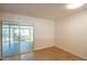 An empty room with tile floors and sliding glass doors leading to the outdoors at 2317 E Concorda Dr, Tempe, AZ 85282