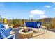 Outdoor fire pit area with stylish seating, desert views, and a cozy atmosphere for relaxing and entertaining at 2317 N Steele Cir, Mesa, AZ 85207